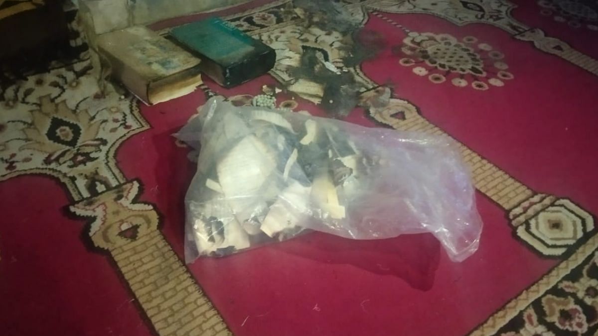 Burned scraps of religious texts found on the floor of the mosque | Amir Qureshi | ThePrint 