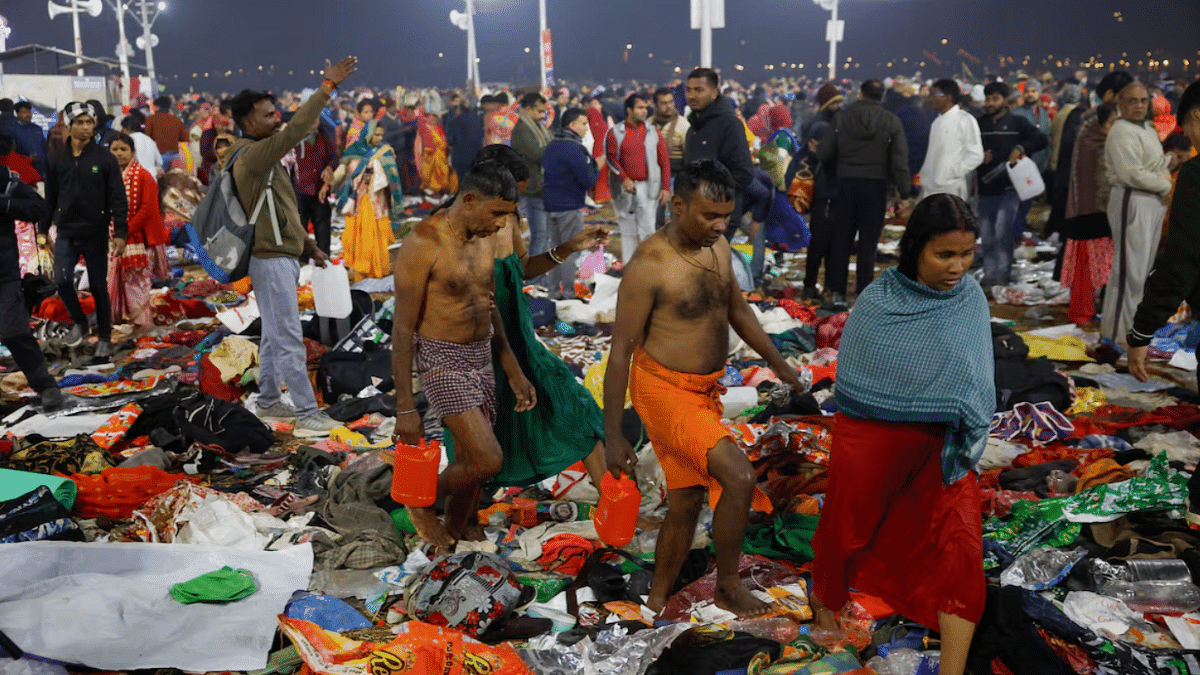 Devotees walk as they leave after a stampede before the second "Shahi Snan" (royal bath) at the "Maha Kumbh Mela" or the Great Pitcher Festival, in Prayagraj, India, 29 January 2025. | Sharafat Ali | Reuters