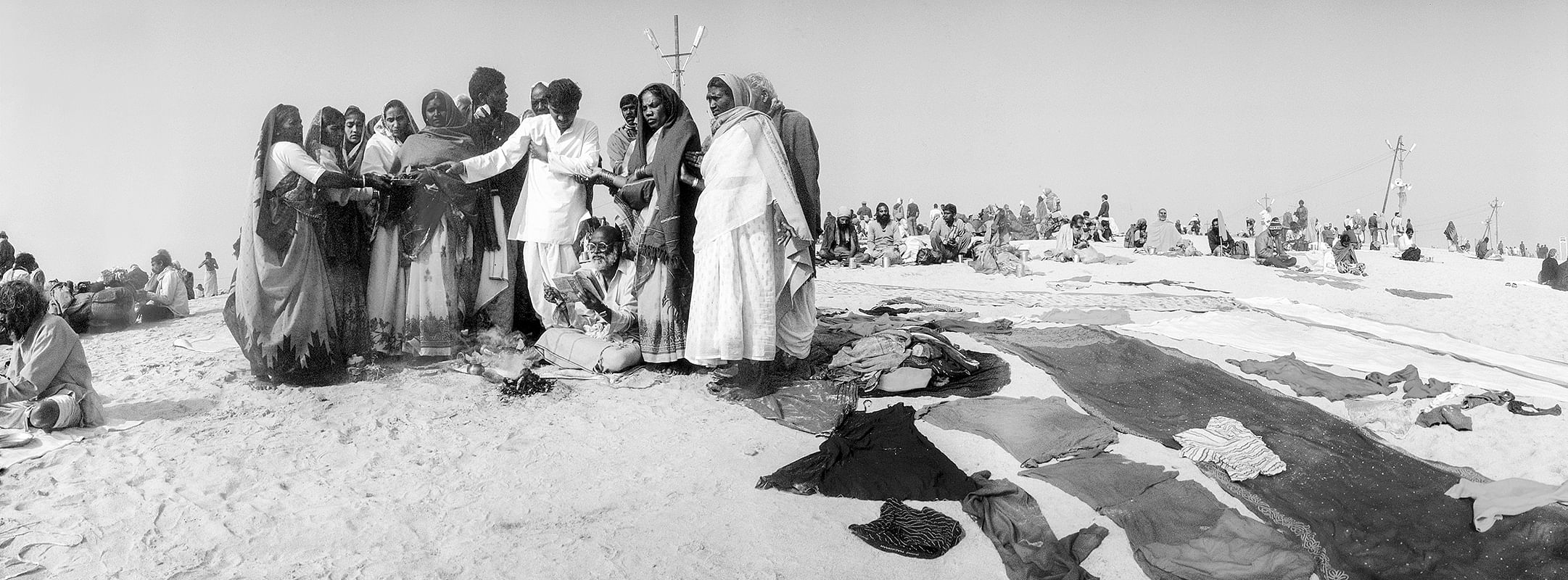 Maha Kumbh Mela 2001: A family prays together after bathing at the Sangam on Makar Sankranti.
