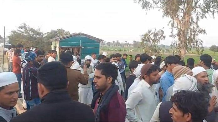 People hold a protest outside Mundkati police station in Palwal Sunday | Photo: By special arrangement