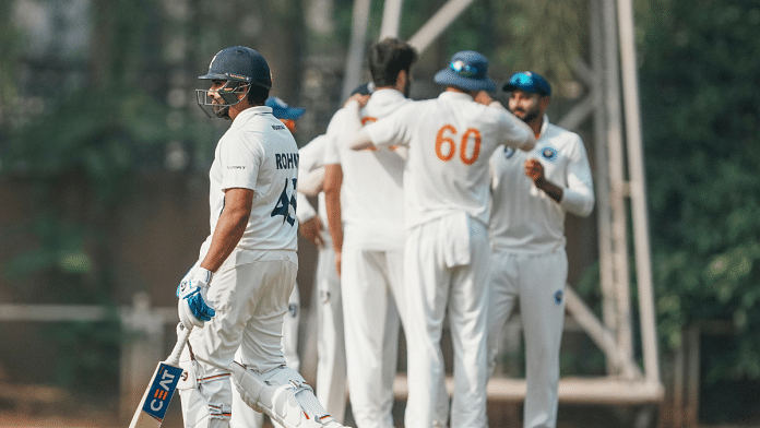 J&K cricketers celebrate the wicket of Rohit Sharma during the first day of the Ranji Trophy match in Mumbai on Thursday | PTI