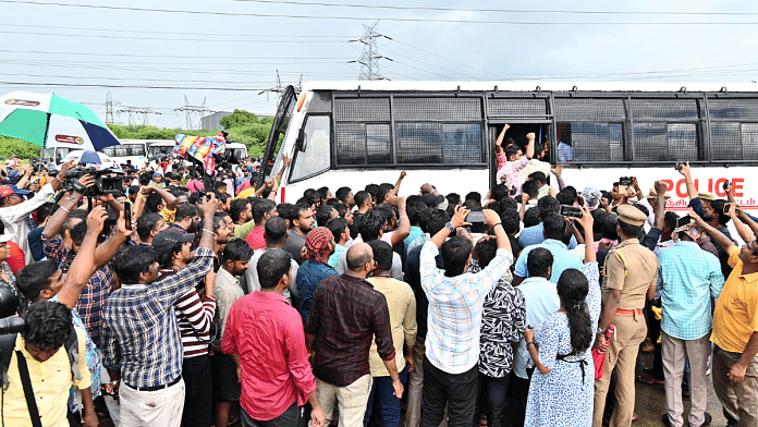 File photo of protesters surrounding a police bus carrying those detained during the Samsung employees' protest | ANI