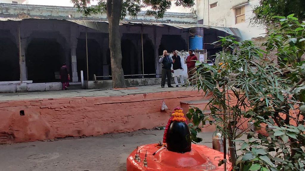 Ajay Sharma and his group at a makeshift shrine, claimed to mark the Shri Krittivaseshwar Mahadev Temple, on the premises of an Aurangzeb-era mosque in Varanasi's Hartirath area | Photo: Shuvhangi Misra | ThePrint 