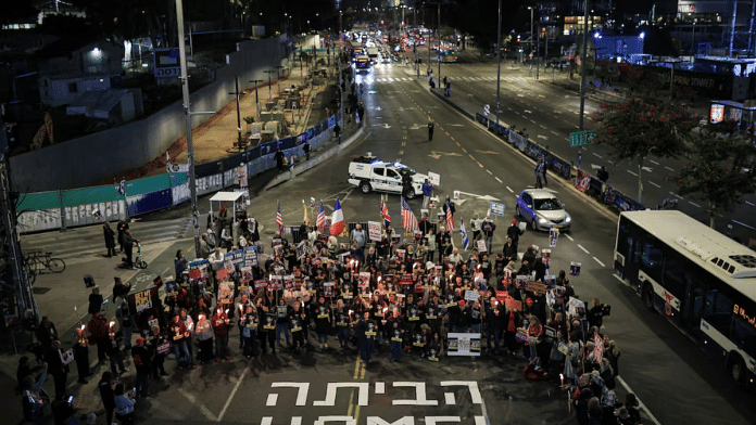 Supporters of Israeli hostages, kidnapped during the deadly 7 October 2023 attack by Hamas, block a road as they demand a deal during a protest amid ongoing negotiations for a ceasefire in Gaza, in Tel Aviv, Israel on 13 January 2025. | Itai Ron | Reuters