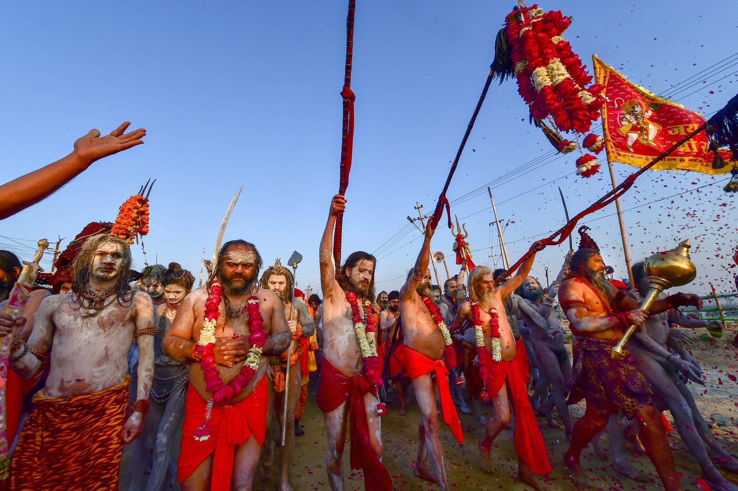 Sadhus from different akharas decked in traditional regalia in a procession for the Shahi Snan