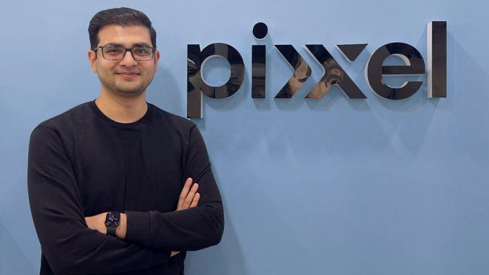 Founder and CEO of the Pixxel Awais Ahmed, poses in front of the company logo in their office in Bangalore, India January 13, 2025 | Reuters