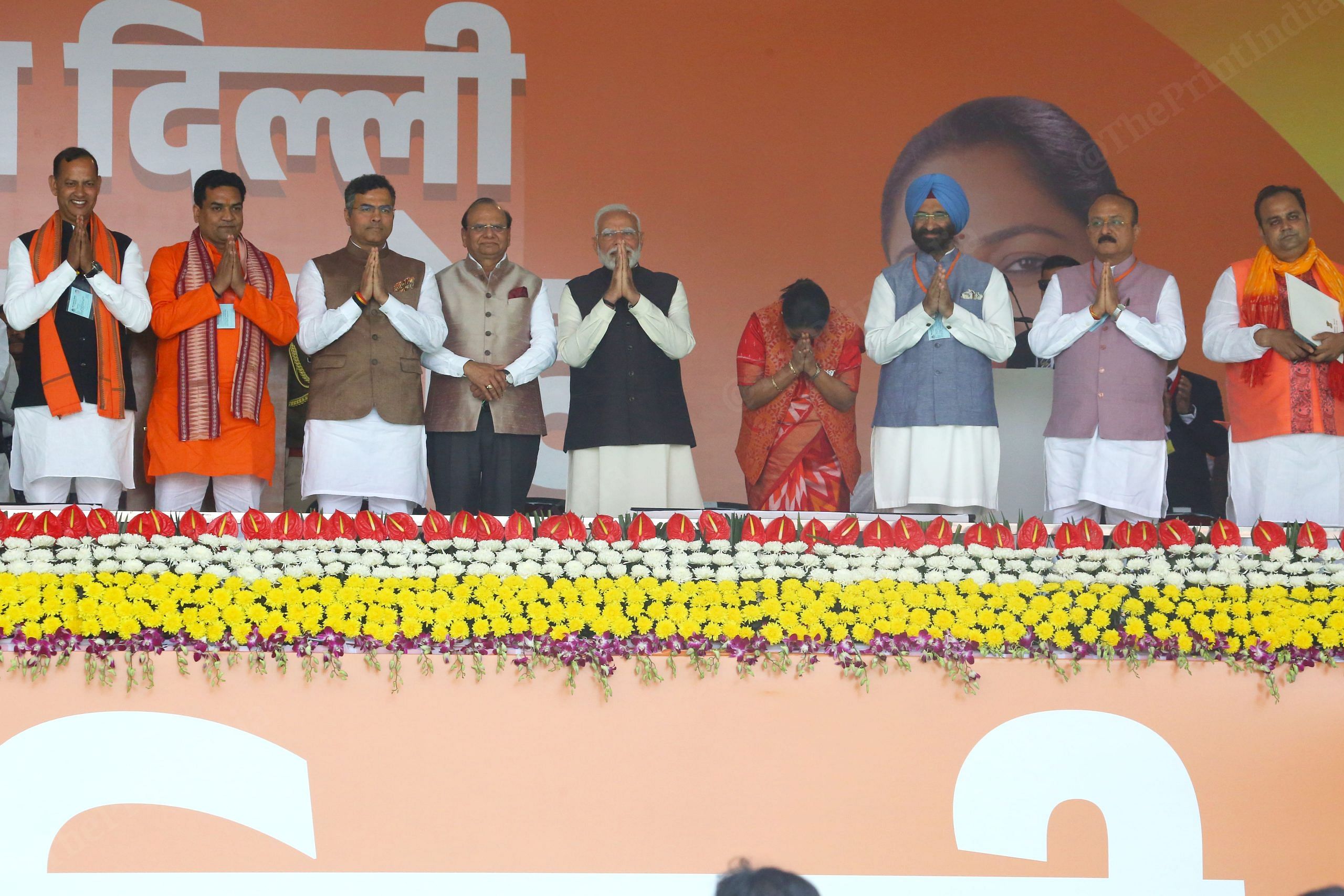 From left to right: Ravinder Indraj Singh, Kapil Mishra, Parvesh Verma, Vinai Kumar Saxena, PM Modi, Rekha Gupta, Manjinder Singh Sirsa, Ashish Sood, and Pankaj Kumar Singh after taking oath | Photo: Praveen Jain | ThePrint