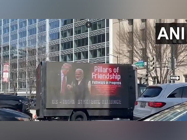 US: Mobile billboard advertising truck displays boards featuring pictures of PM Modi, Trump