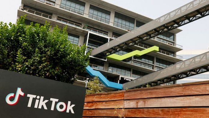 Representational Image of the logo of social media application TikTok with urban construction in the background | Reuters