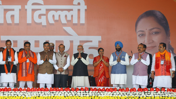 (Left to right) MLAs Ravinder Indraj Singh, Kapil Mishra, Parvesh Verma, L-G VK Saxena, PM Narendra Modi, CM Rekha Gupta, MLAs Manjinder Singh Sirsa, Ashish Sood and Pankaj Singh during the swearing-in ceremony of Delhi Chief Minister | Suraj Singh Bisht | ThePrint