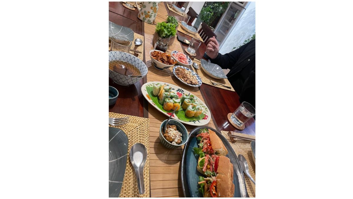 A glimpse of Vietnam-Ease Càphê's long table featuring Banh Mi among other delicacies | Triya Gulati, ThePrint