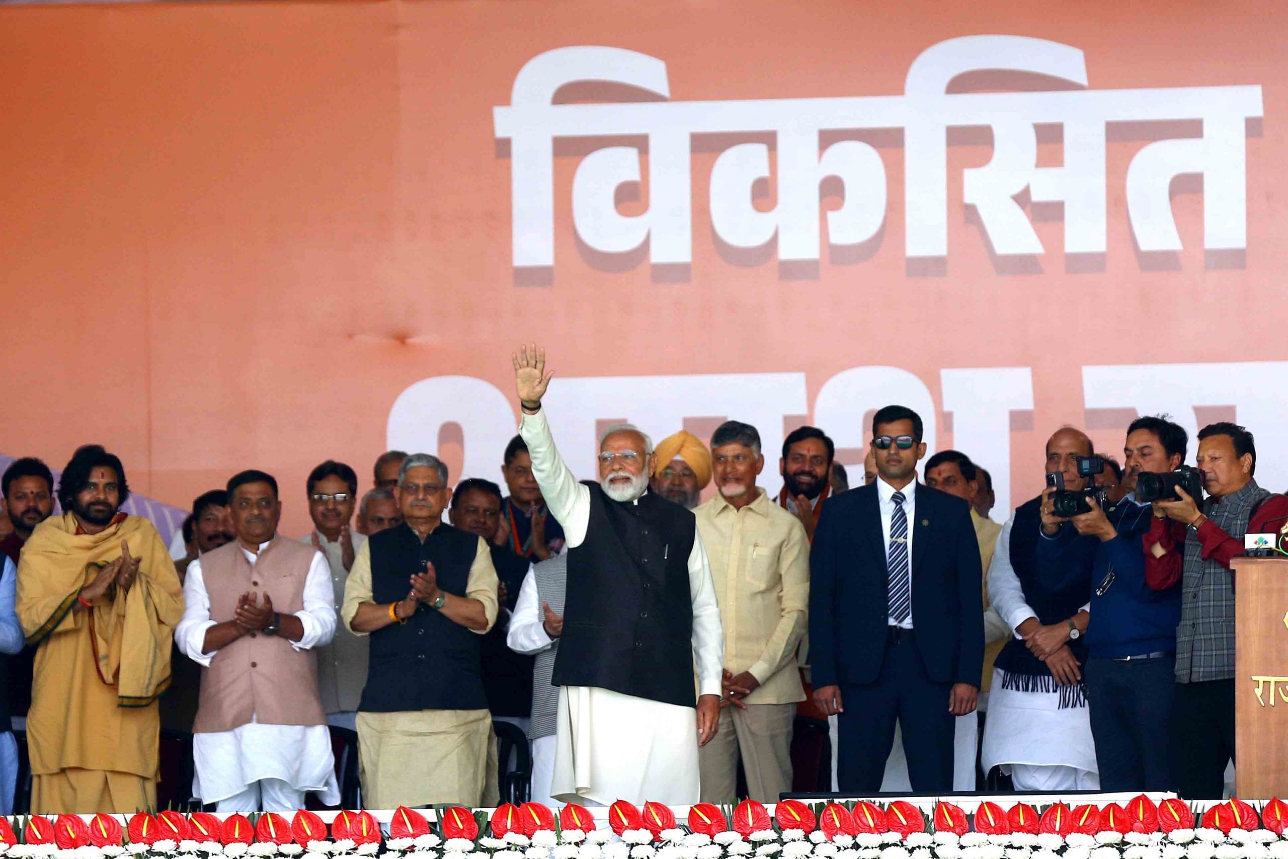 PM Modi waves at the crowd | Photo: Suraj Singh Bisht | ThePrint