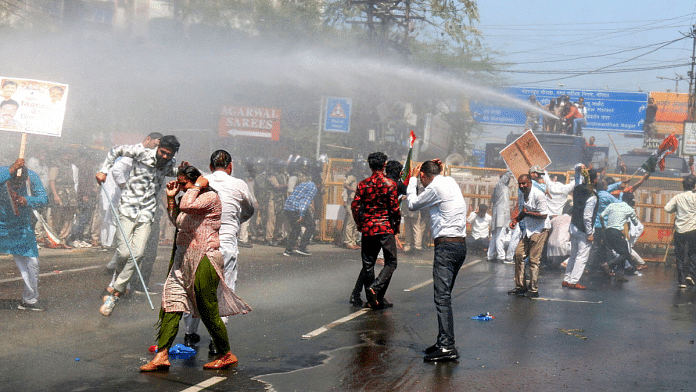 Police personnel use water cannons to disperse Congress supporters as they protest over farmers' issues during the Madhya Pradesh Budget Session, in Bhopal on Monday, 10 March 2025. | ANI