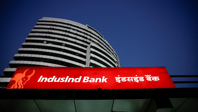 An illuminated signboard of IndusInd Bank is seen outside one of its branches, in New Delhi, India, September 20, 2024