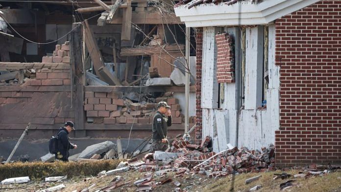 Officials inspect an area with damaged buildings after South Korea's Air Force said that Mk82 bombs fell from a KF-16 jet outside the shooting range during joint live-fire exercises near the demilitarized zone separating two Koreas in Pocheon, South Korea Thursday | Reuters/Kim Hong-Ji