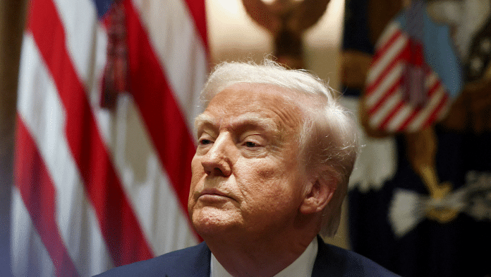 U.S. President Donald Trump looks on on the day of a meeting with U.S. ambassadors at the White House in Washington, D.C., U.S., on 25 March 2025. | Evelyn Hockstein | Reuters