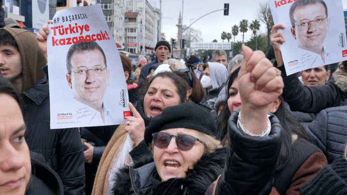 Supporters of Istanbul Mayor Ekrem Imamoglu gather near the city's police headquarters in Istanbul, Turkey, on 19 March 2025. | Tolga Uluturk | Reuters