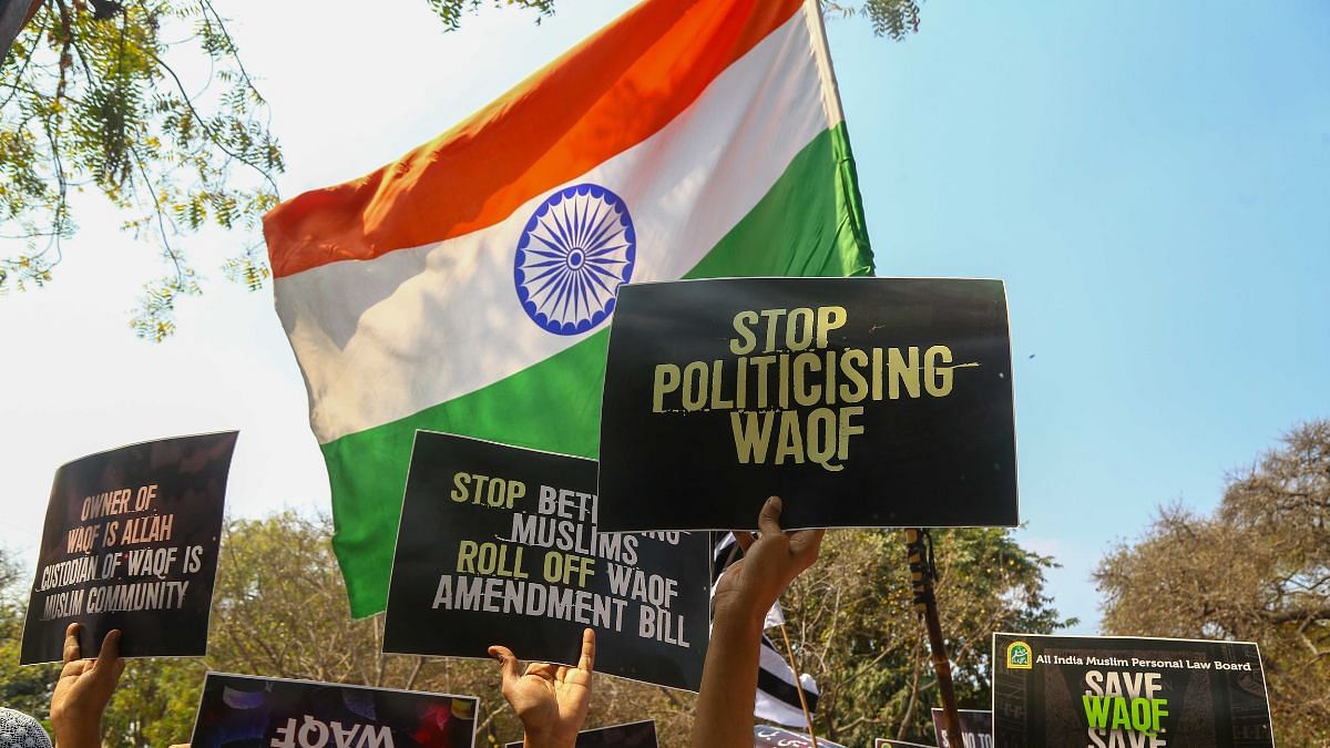 Protesters wave the Indian flag at the demonstration. | Suraj Singh Bisht | ThePrint