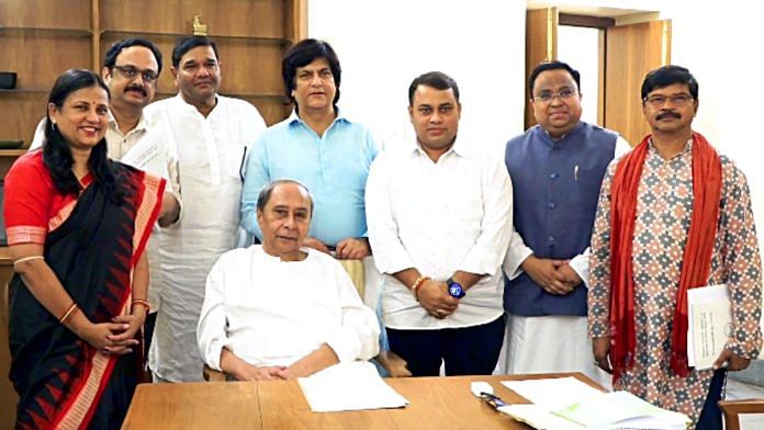 File photo of BJD chief Naveen Patnaik with party's Rajya Sabha MPs | ANI