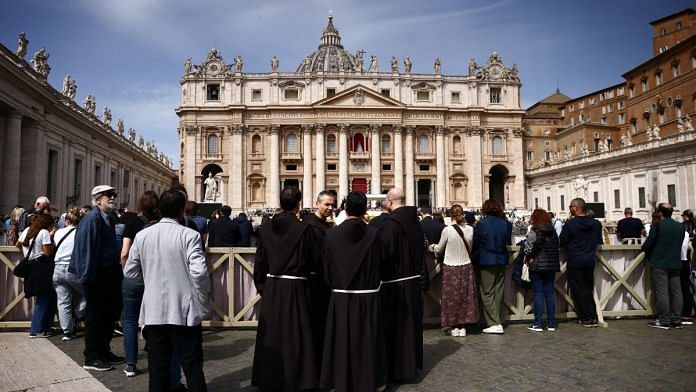 Clergy members stand in St. Peter's Square, after the death of Pope Francis was announced by the Vatican in a video statement, at the Vatican, 21 April, 2025 | REUTERS/Yara Nardi
