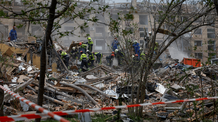 Rescuers search for 17-year-old Danylo Khudia and his parents at the side of an apartment building hit by a Russian missile strike, amid Russia's attack on Ukraine, in Kyiv, Ukraine April 24, 2025 | Reuters