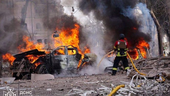 Firefighters work at the site of a Russian missile strike, amid Russia's attack on Ukraine, in central Sumy, Ukraine on 13 April 2025. | Press service of the State Emergency Service of Ukraine | Handout via Reuters
