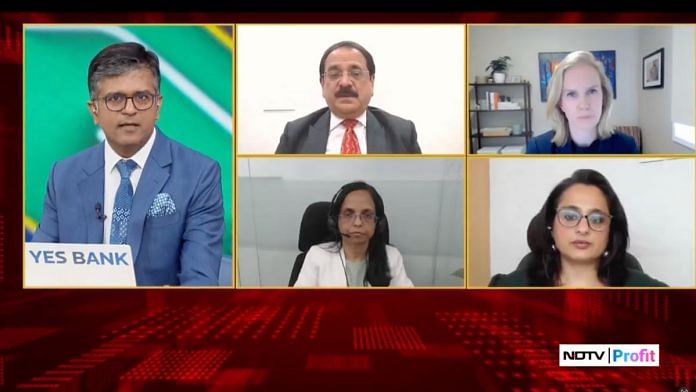 Business news anchors reporting on global market crash calmly