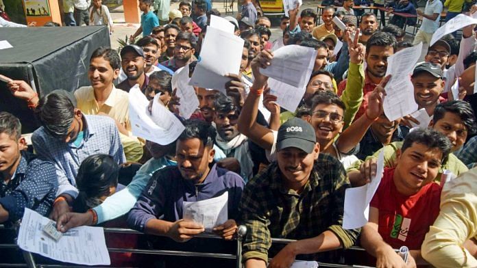 Candidates que up outside an examination centre to appear for the UPSSSC preliminary eligibility test in Prayagraj | Representative image | ANI