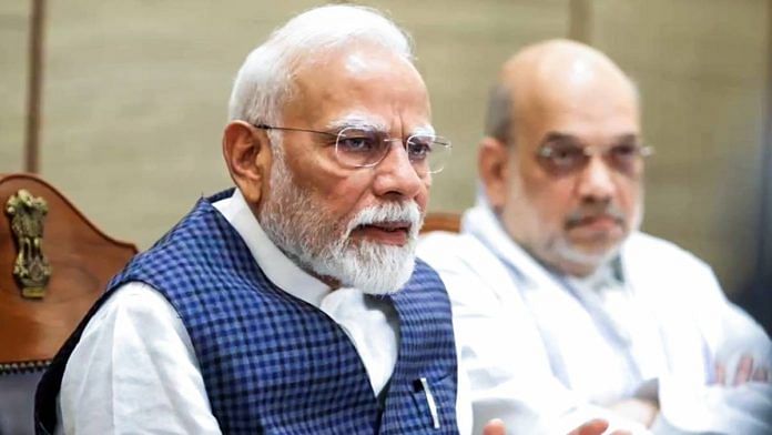 Prime Minister Narendra Modi with home minister Amit Shah at a cabinet meeting in New Delhi Wednesday | Photo: ANI