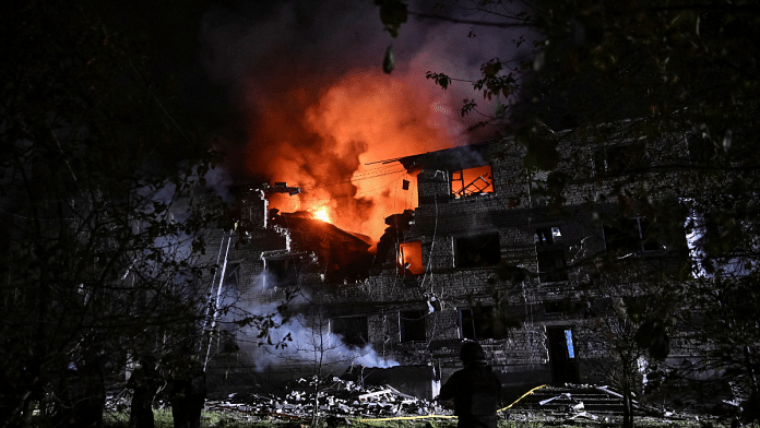Rescuers work at a site of an apartment building hit by a Russian drone strike, amid Russia's attack on Ukraine, in Zaporizhzhia, Ukraine on 1 May 2025. | Stringer | Reuters