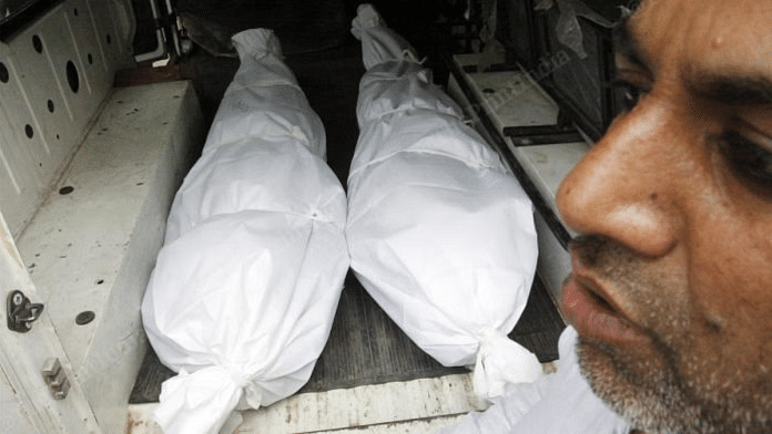 Bodies of Aamir and Hashim in a van after their postmortem. The bodies was found in a drain on 26 Feb 2020. | File photo: Praveen Jain | ThePrint
