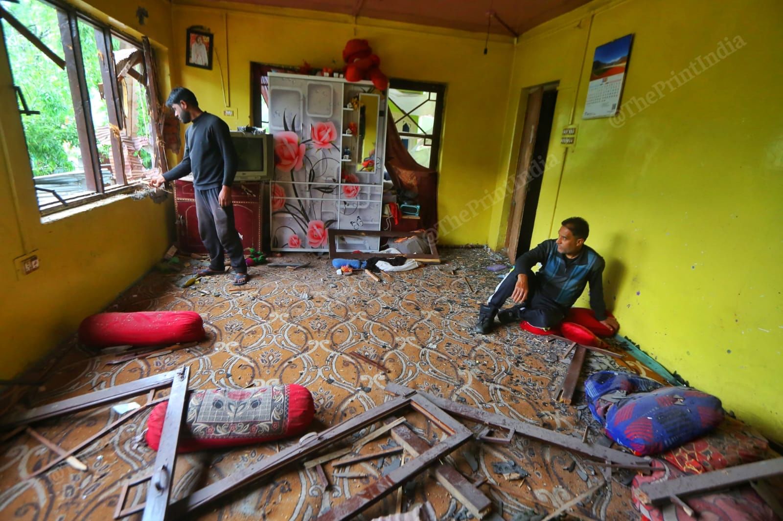 Mohammed Ashraf and Ishfaq Ahmed inside their wrecked house | Photo: Praveen Jain | ThePrint