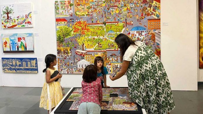 Children gathered in front of an illustration, using it to figure out the puzzle below | Antara Baruah, ThePrint