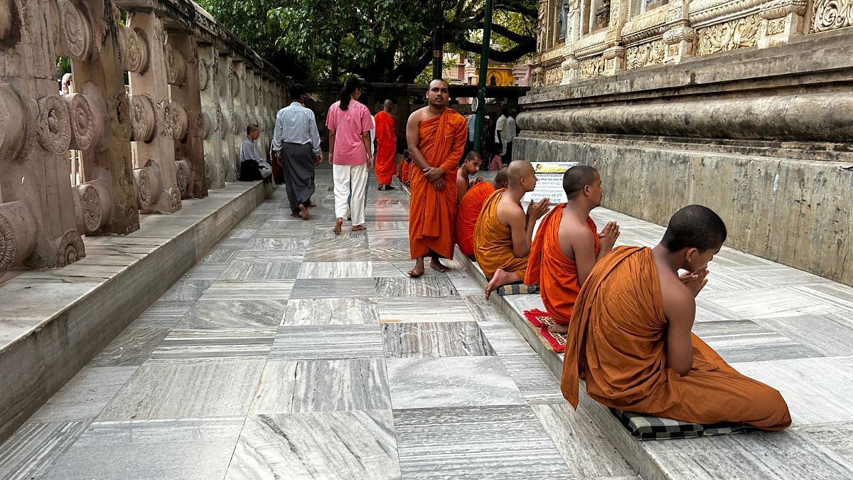 Buddhist monks engaged in evening prayers at the Mahabodhi Temple in April 2025 | Jyoti Yadav, ThePrint