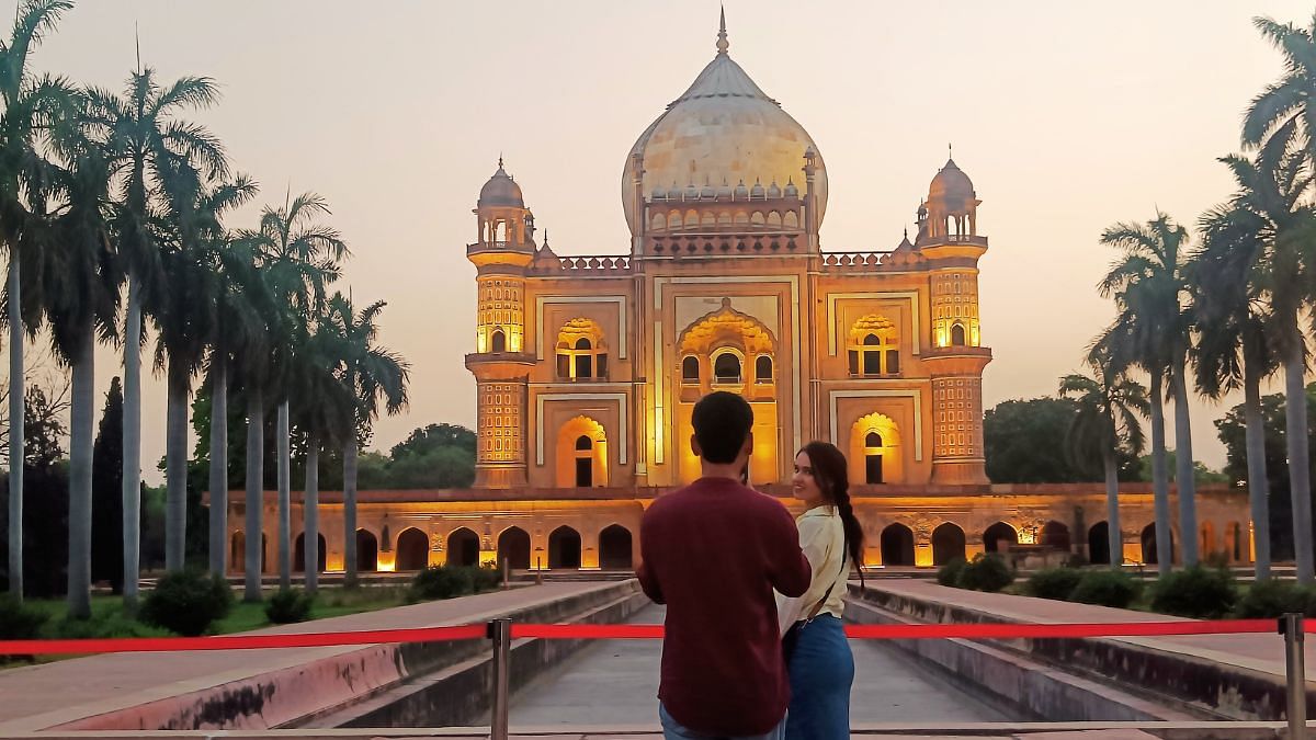 Couple clicking pictures at the Safdarjung Tomb | Krishan Murari, ThePrint