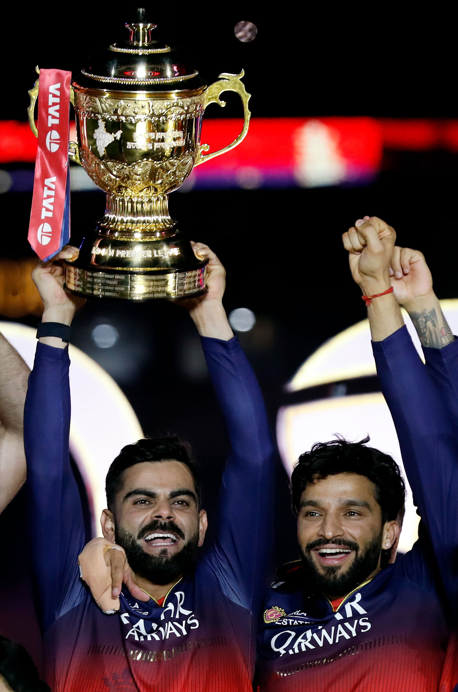 Virat Kohli and Captain Rajat Patidar lift the trophy after the team's win in the Indian Premier League 2025 | Photo: ANI
