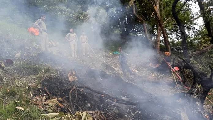 Security personnel at the spot after a helicopter crashed near the Kedarnath shrine on 15 June 2025. | PTI