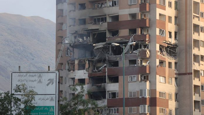 A damaged building stands in the aftermath of Israeli strikes, in Tehran, Iran, Friday | Reuters
