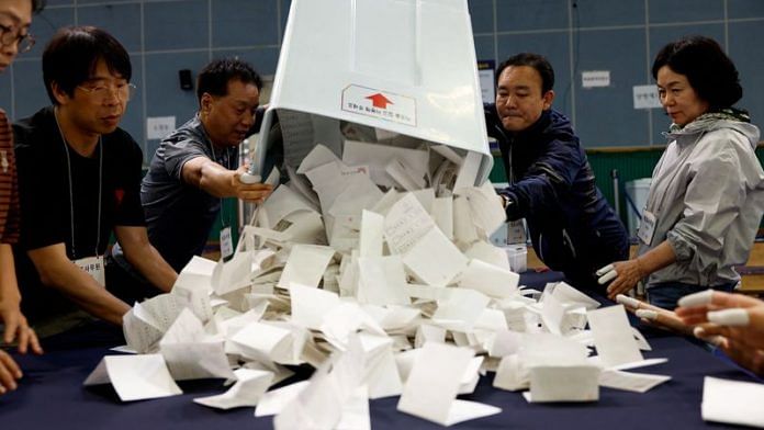 National Election Commission officials count ballots for the presidential election in Seoul, South Korea, on 3 June 2025. | Kim Soo-hyeon | Reuters