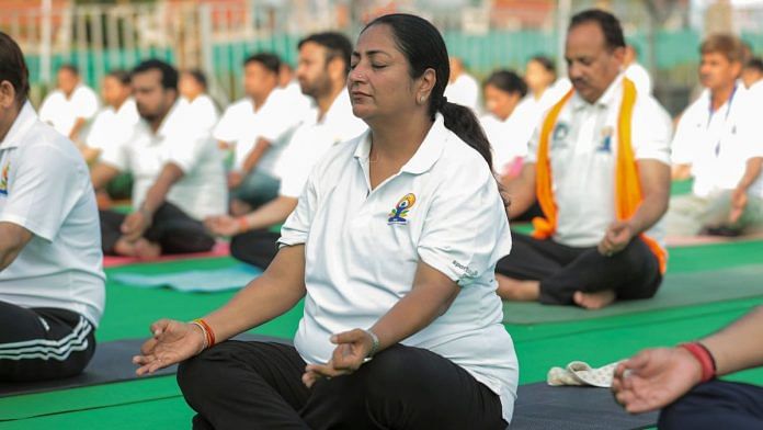 Delhi Chief Minister Rekha Gupta takes part in a yoga session on the International Day of Yoga, in New Delhi. (@gupta_rekha via PTI Photo)