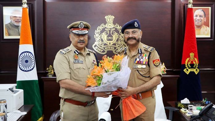 Newly appointed Uttar Pradesh Director General of Police (DGP), Rajeev Krishna (left) felicitated by outgoing State DGP Prashant Kumar, in Lucknow, Saturday. | ANI