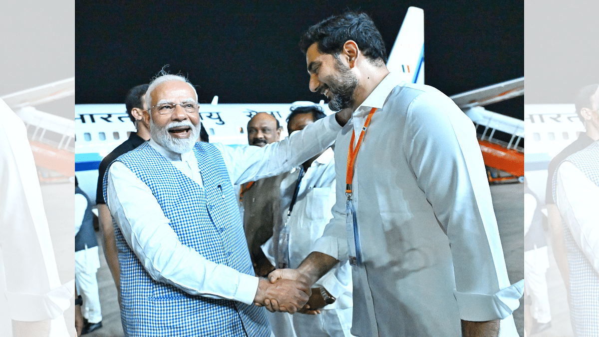 PM Modi shares a light moment with TDP scion Lokesh at Vizag airport on eve of yoga day | By special arrangement 