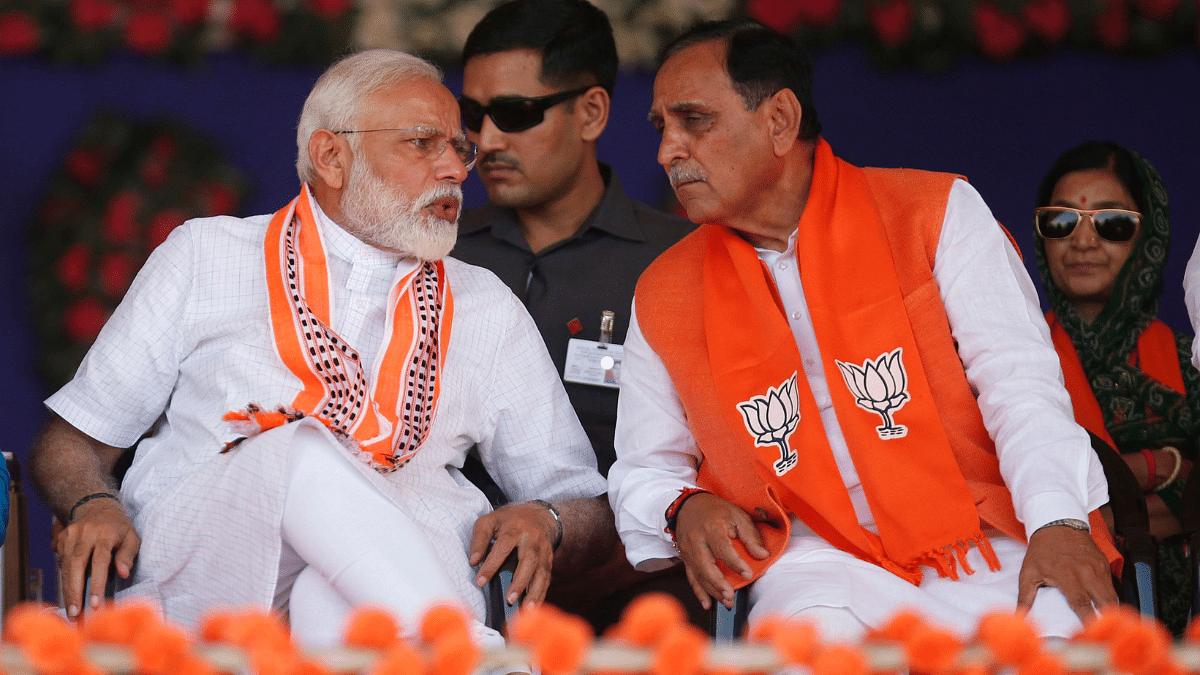 In this 10 Apr 2019 photo, PM Modi interacting with then Gujarat CM Vijay Rupani during election campaign in Junagadh. | ANI