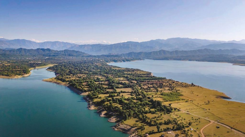 The tranquil waters of the Ranjit Sagar Dam at Basohli in Jammu are set in a serene landscape. The lake created by the dam is popularly known as ‘Mini Goa’. | Ashish Sharma 