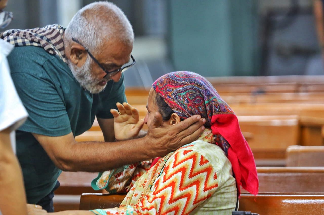 Junaid's mother being consoled as she waits at the DNA collection centre set up at BJ Medical College | Praveen Jain | ThePrint