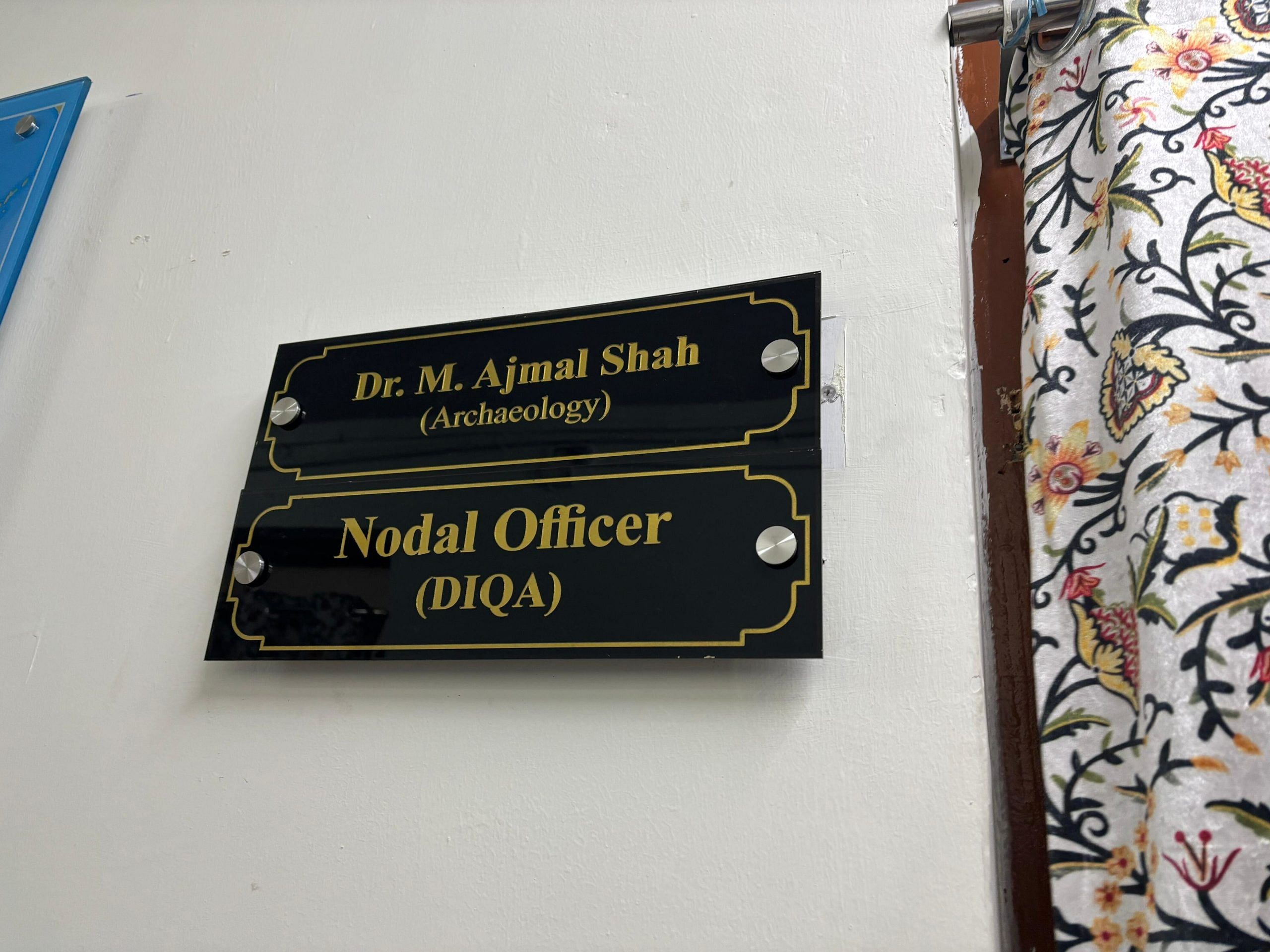 Ajmal Shah's nameplate outside his office 