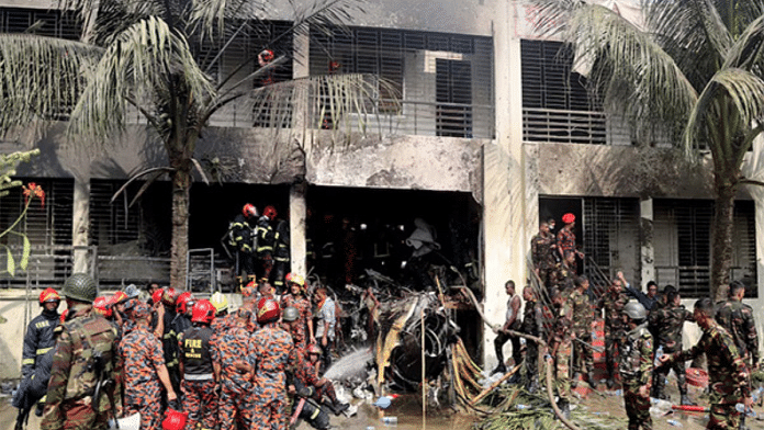 Firefighters and soldiers at the crash site of a Bangladesh Air Force training jet in Dhaka | Reuters
