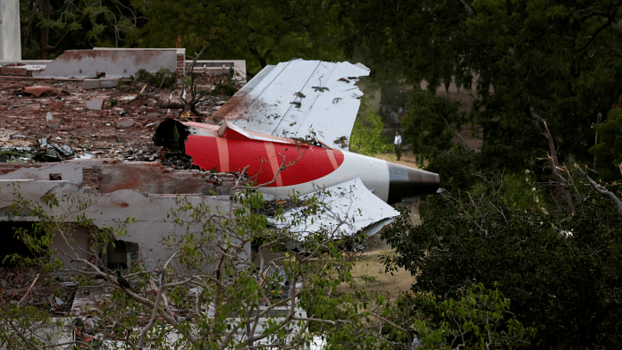 Air India crash report leak | File photo of Tail of an Air India Boeing 787 Dreamliner plane that crashed is seen stuck on a building after the incident in Ahmedabad, India, June 12, 2025 | Reuters
