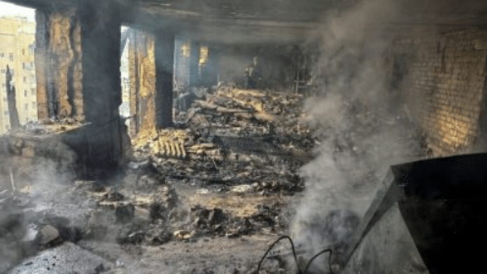 Firefighters work inside an apartment building hit by a Russian drone strike, amid Russia's attack on Ukraine, in Kharkiv, Ukraine on 7 June 2025 | Reuters