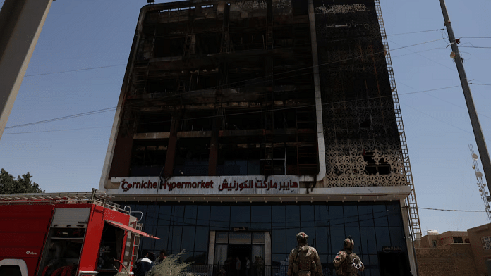 A fire truck stands next to the wreckage of a five-storey shopping center, after a massive overnight fire killed dozens of people, in al-Kut, Wasit province, Iraq, July 17, 2025 | Reuters